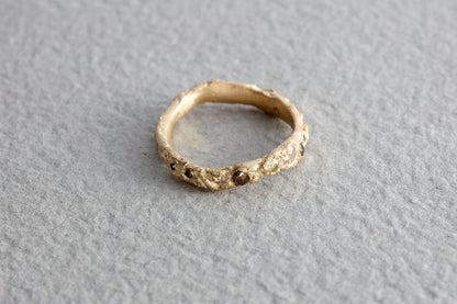 Handcrafted alternative wedding ring with natural organic texture, artisan made