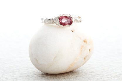 Artisan chunky sterling silver ring with raspberry sapphire and handcrafted molten textured surface, made in Devon UK