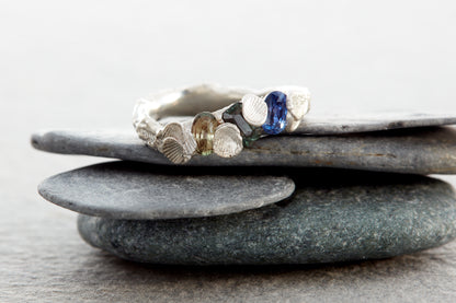 Sculptural silver Shellscape ring with organic ocean-inspired texture and multicolour sapphires in blue, teal and green tones. Handmade in Devon