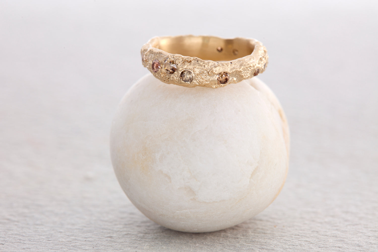 Bespoke textured gold promise ring with champagne and earthy brown diamonds, sculptural handcrafted jewellery made in North Devon